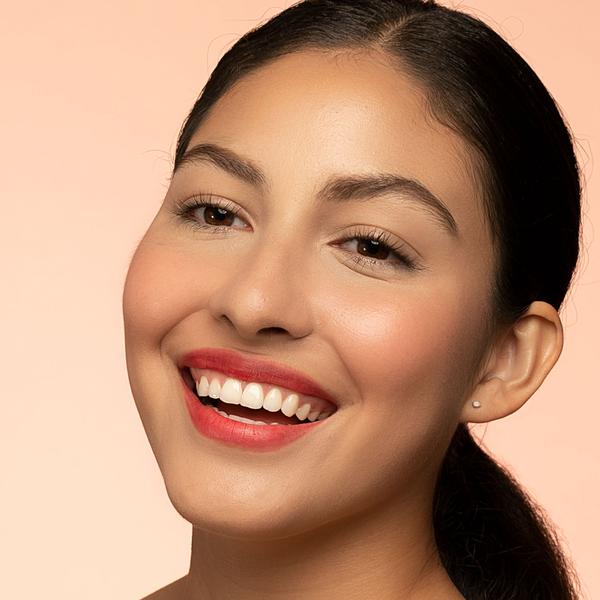 Woman with natural makeup wearing Bésame Cosmetics Cream Rouge