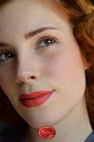 Woman With red Hair Wearing Red Lipstick by Bésame Cosmetics 