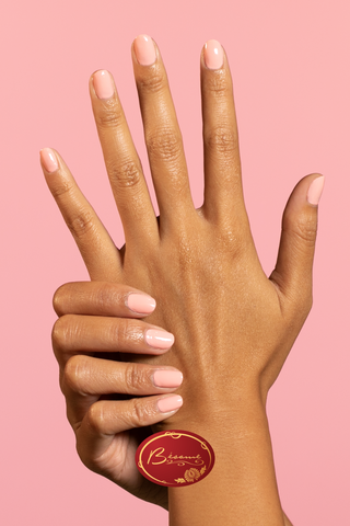 hand-neutral-pastel-pink-nail-polish